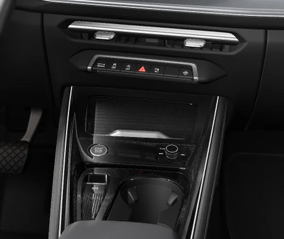 Console central do Audi Q3 com o botão de partida, o controle de volume e os porta-copos
