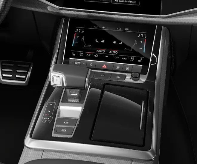 Console central do Audi Q7 com a tela de climatização e o seletor do câmbio